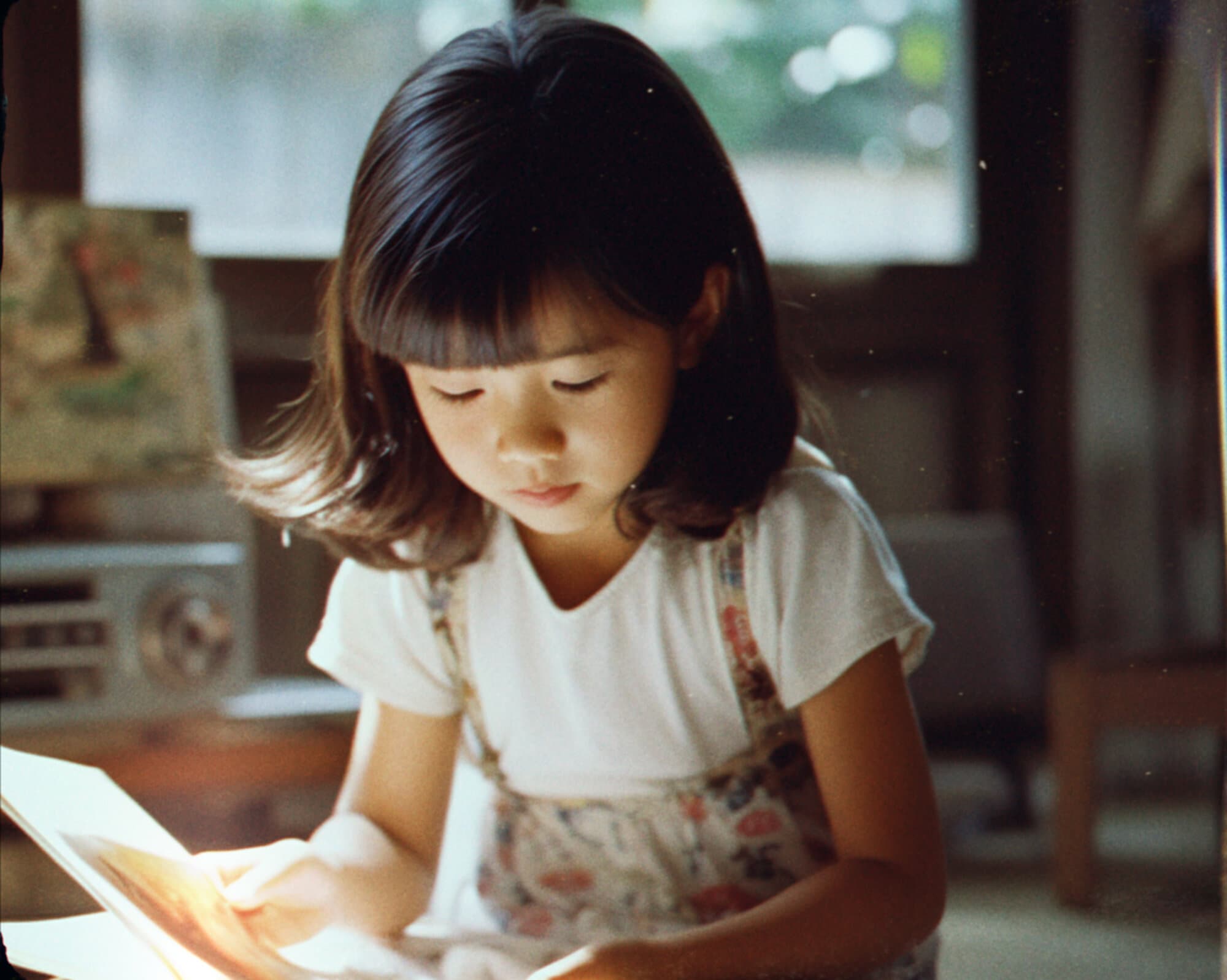 A child reading by a window